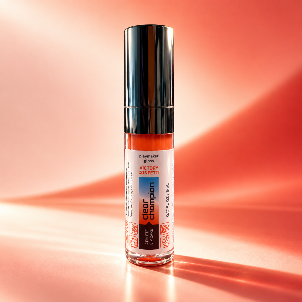 A bottle of Victory Confetti glossy nail polish by Glamsymerizer, standing upright on a reflective surface against a warm orange and pink gradient background.